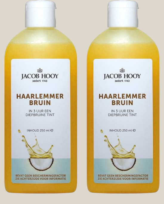 Twee flessen Jacob Hooy Haarlemmerbruin bruiningsolie van TuanaShop BV met natuurlijke ingrediënten en kokosnoot