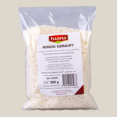 TuanaShop BV geraspte kokos in een transparante verpakking van 200 gram voor bakken en koken