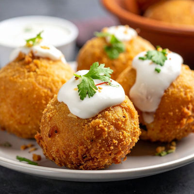 Arancini van saffraan en cantharellen (gefrituurde risottoballetjes)