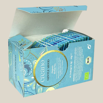 TuanaShop BV Gentle Mood biologische kruidenthee met rooibos en kaneel in een open doosje met 20 theezakjes.