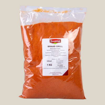 TuanaShop BV Braad- en Grill Kruidenmix in een transparante verpakking van 1 kg met paprikapoeder en uienpoeder.