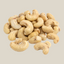 Een hoopje ongebrande en ongezouten XL cashewnoten van TuanaShop BV met een romige kleur en stevige textuur.
