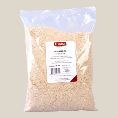 TuanaShop BV Schnitzel Paneermix in een doorzichtige verpakking voor een krokante goudbruine korst op vlees of kip.
