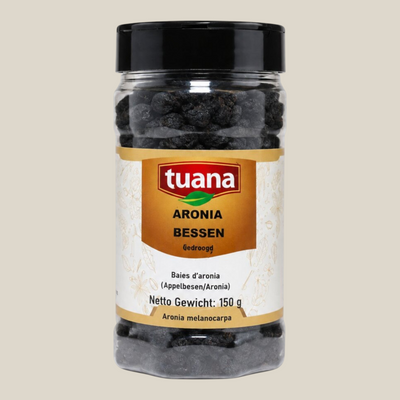 TuanaShop BV gedroogde aronia bessen in een doorzichtige pot met zwart deksel, rijk aan antioxidanten.