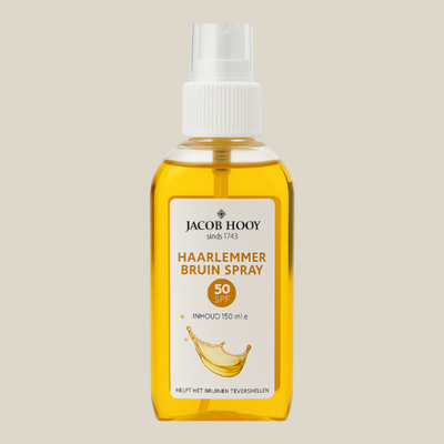 TuanaShop BV Jacob Hooy Haarlemmer Bruin Spray SPF 50 in een transparante fles van 150ml voor een egale bruine teint.