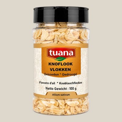 TuanaShop BV knoflook vlokken in een doorzichtige pot met zwarte dop, gedroogde knoflookstukjes voor in gerechten.