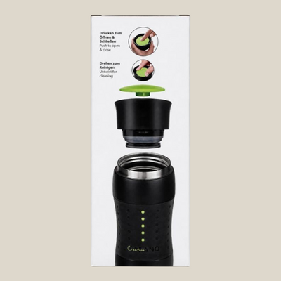 TuanaShop BV Creano travel mug in zwarte verpakking met instructies voor de 360 graden drinkopening en reiniging